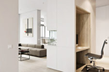 08 Light-colored wooden floors, white furniture and ceilings make the apartment feel more spacious