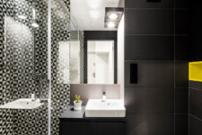 08 The bathroom is done in matte black and with graphic geo print tiles in the shower, it looks modern and very chic