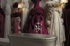 08 Unique 3D wallpaper showing giant tassels creates a bold look in the bathroom