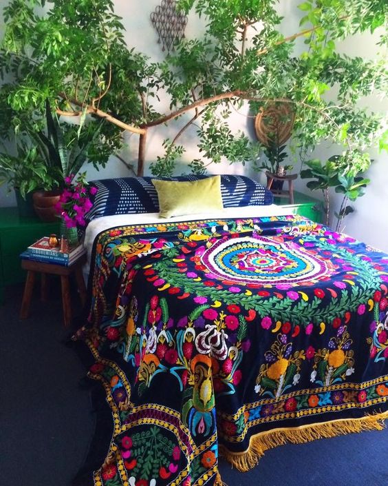colorful printed bedspread with tassels and printed pillows