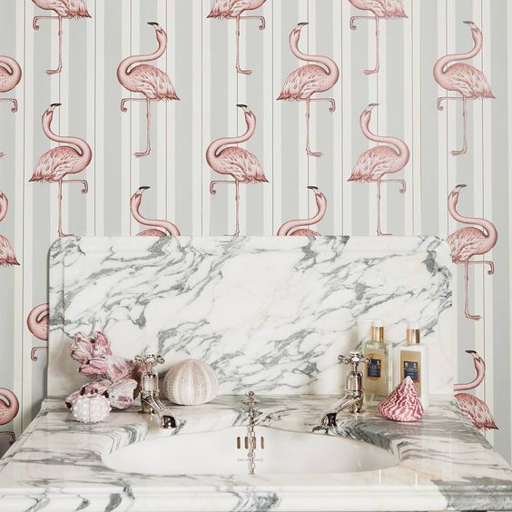 grey striped wallpaper with light pink flamingo prints for a girlish bathroom