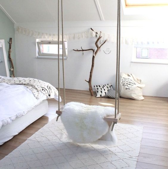 this cozy fur covered swing adds a comfortable feel to the room