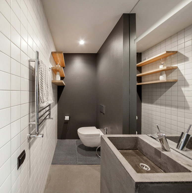 The guest bathroom is equally simplistic and stylish, being mainly focused on shades of gray