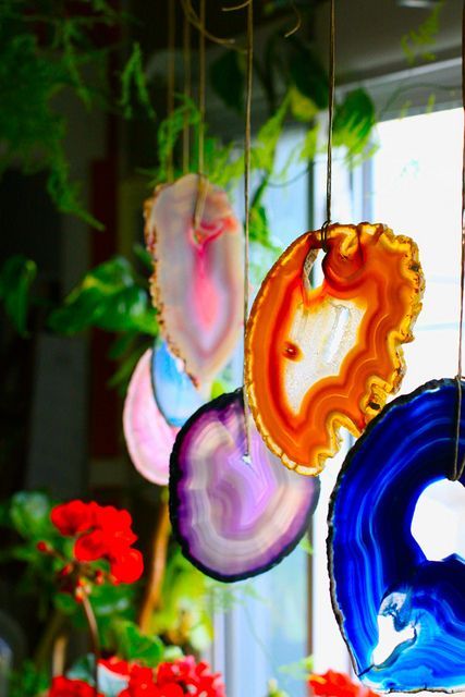 colorful geode hangers on the window will make your space play with colors