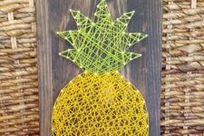 11 pineapple string art on a board can be DIYed