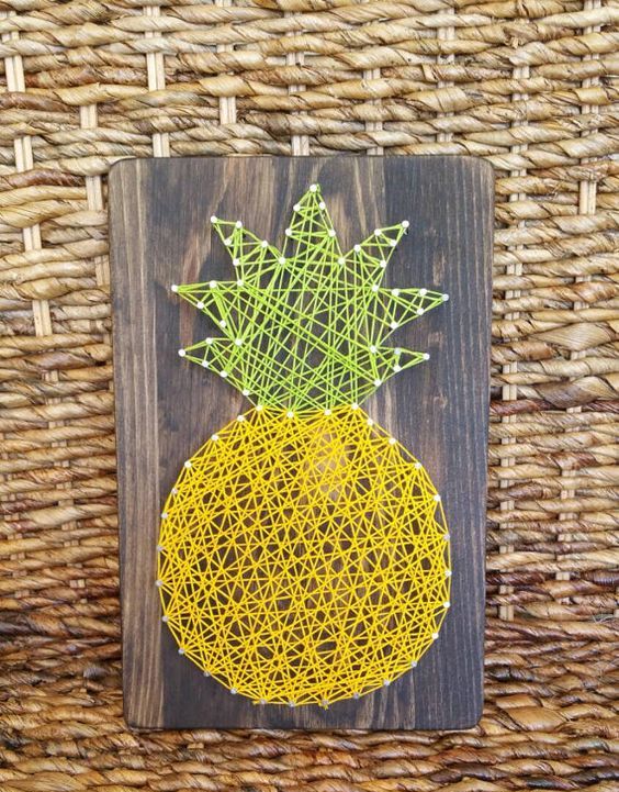 pineapple string art on a board can be DIYed