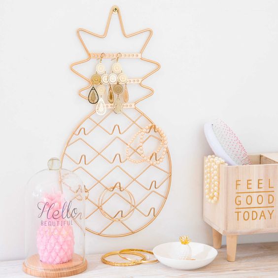 a wall pineapple jewelry holder is a cute idea for a girl's room