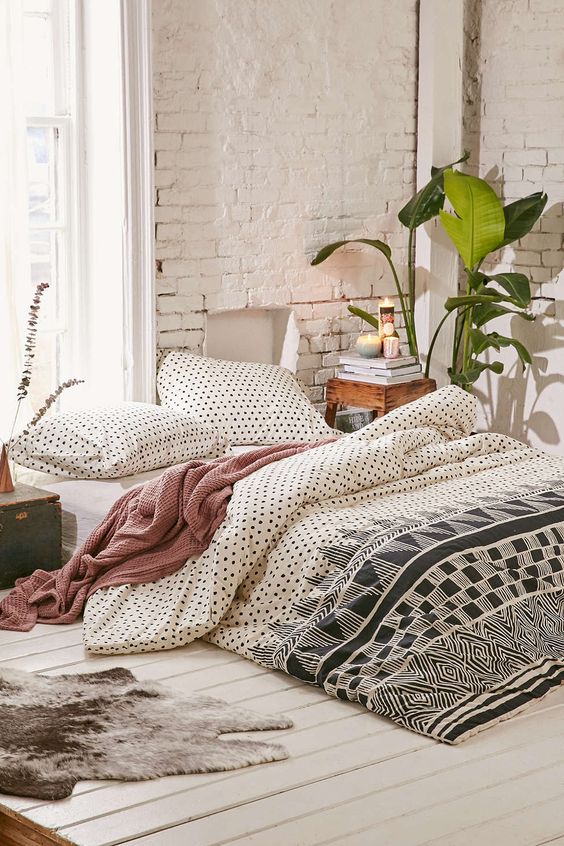 black and white polka dot and graphic print bedding can fit also a mid-century bedroom