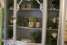16 oversized white shabby chic cupboard with chicken wire instead of glass that gives it a unique feel
