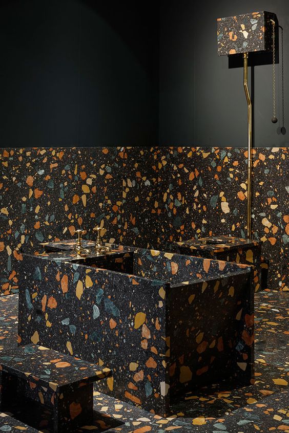 dark terrazzo with colorful inserts for the bathroom floor, walls and the bathtub itself