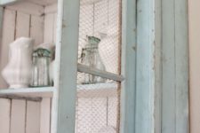 17 mint cupboard with chicken wire and white paint insde for a contrasting look