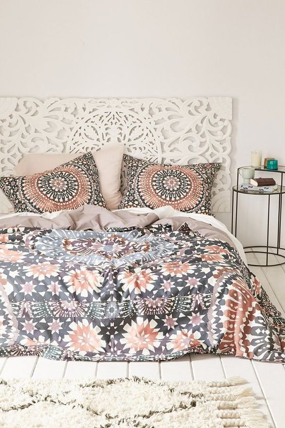 copper, black and white bold printed bedding echo with the headboard