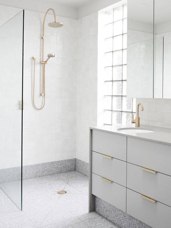 grey terrazzo floors and white walls for a peaceful bathroom look