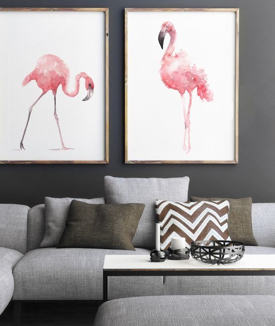 pink watercolor flamingo wall art pieces add color to this monochrome grey space