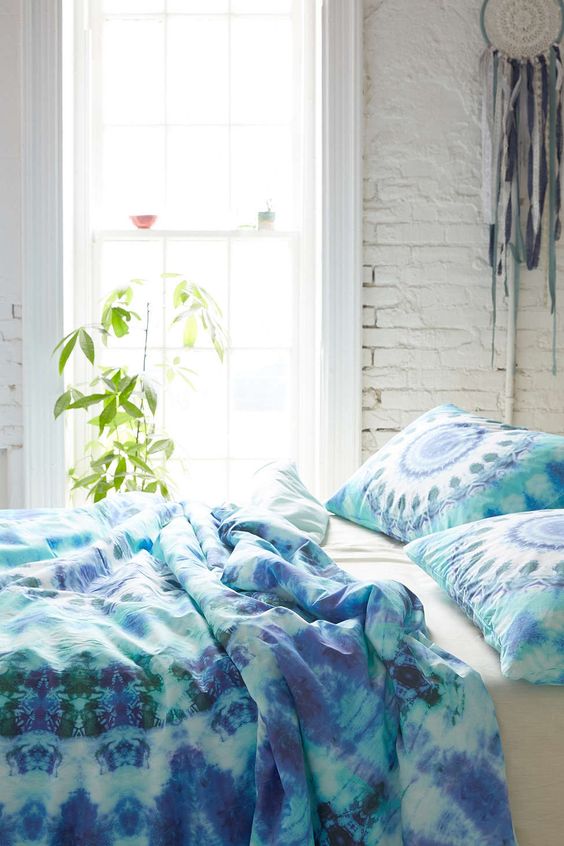 green and blue watercolor bedding and medallion print pillows