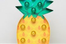 21 a fun pineapple marquee light is a cute and trendy idea