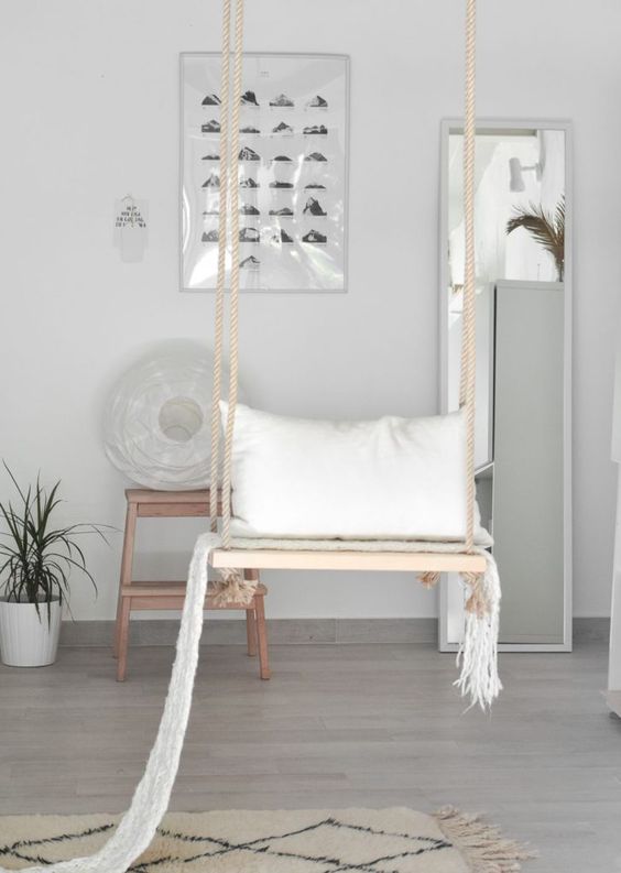 a swing can be a dreamy open storage unit for your pillows and blankets