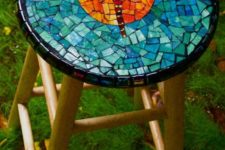 21 a wooden stool with a colorful dragonfly mosaic on top for a cool look