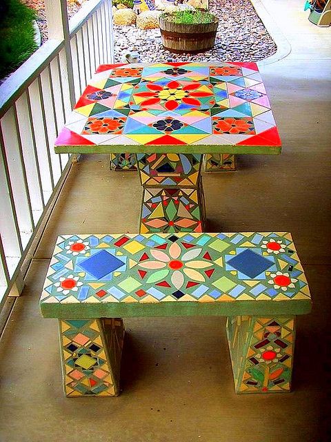 a colorful mosaic table and benches with a retro feel and bold patterns