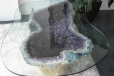 22 a jaw-dropping coffee table with an amethyst geode base and a glass top will be a showstopper
