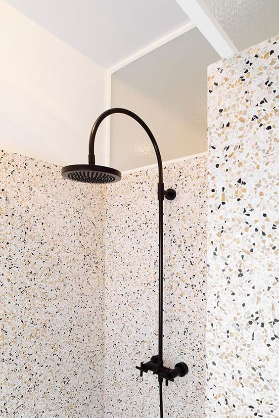 terrazzo shower and walls covered with a different type of terrazzo