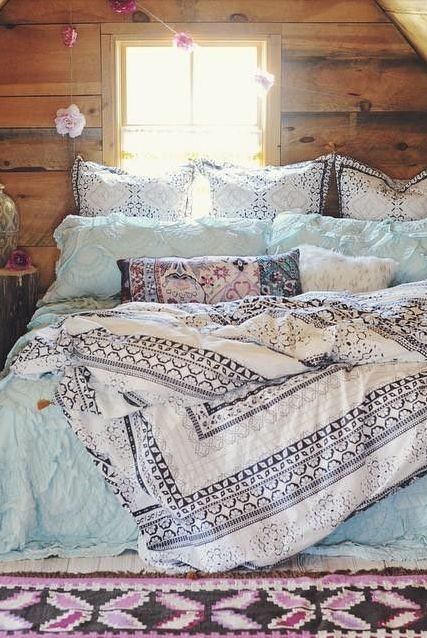 textural blue and navy and white printed bedding create a nonchalant feel