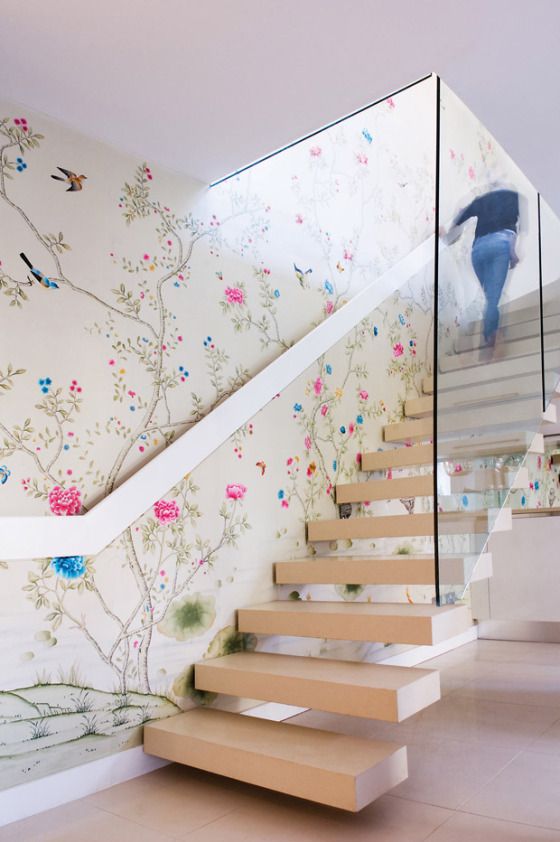 chinoiserie-inspired floral wallpaper and neutral stairs that stand out
