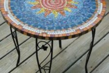 24 pretty outdoor table with a colorful sun mosaics and on forged legs