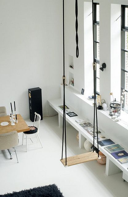 Nordic dining space with a black rope swing as an eye-catchy and dreamy touch
