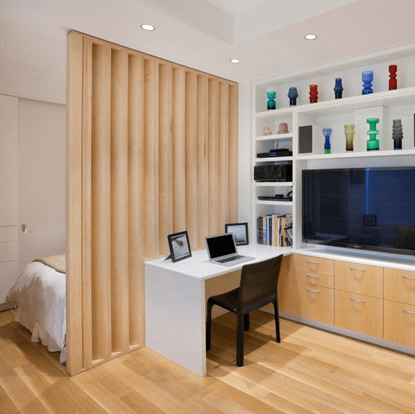 a vertical wooden partition is a warm and stylish solution for dividing the space