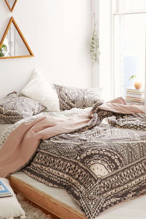 blush, brown and white boho printed bedding for a girlish space