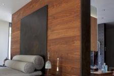 26 a tall headboard wooden wall acts as a space divider here and makes the bedroom private