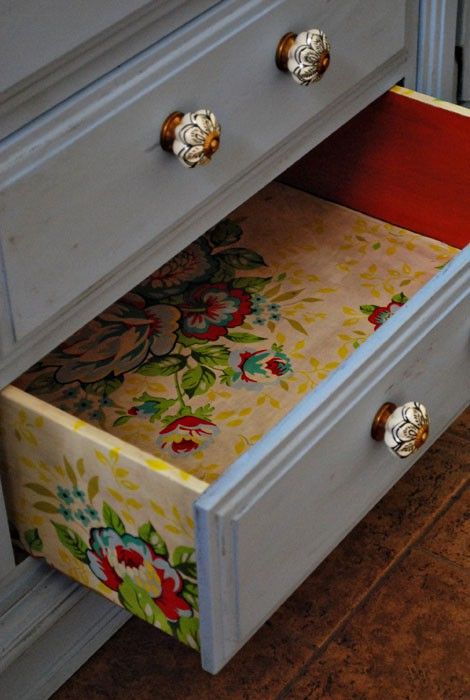 colorful floral wallpaper inside the drawers and on the sides for a bold look
