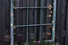 28 illuminate your old window planter with beautiful flowers with LED lights