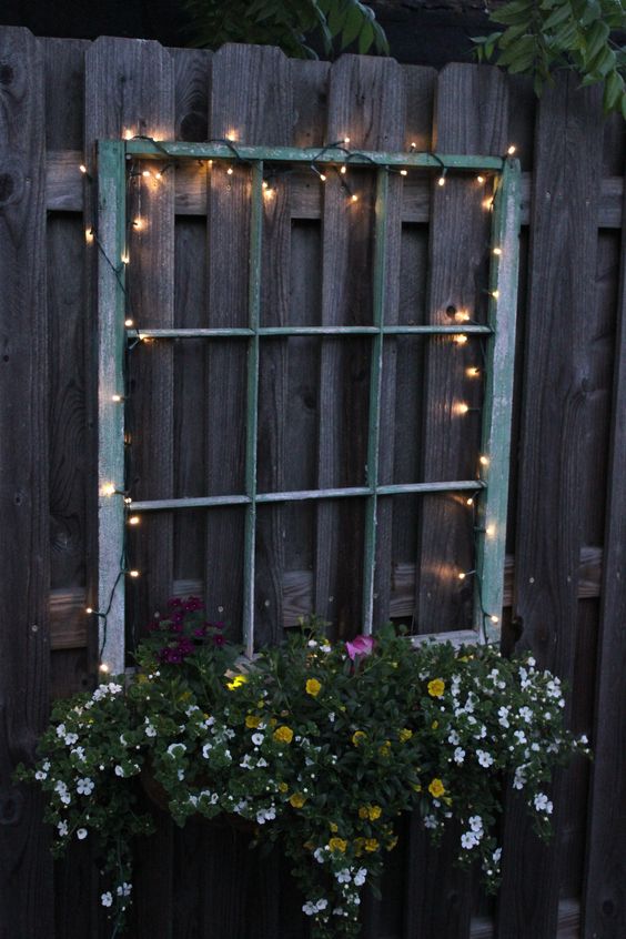 illuminate your old window planter with beautiful flowers with LED lights