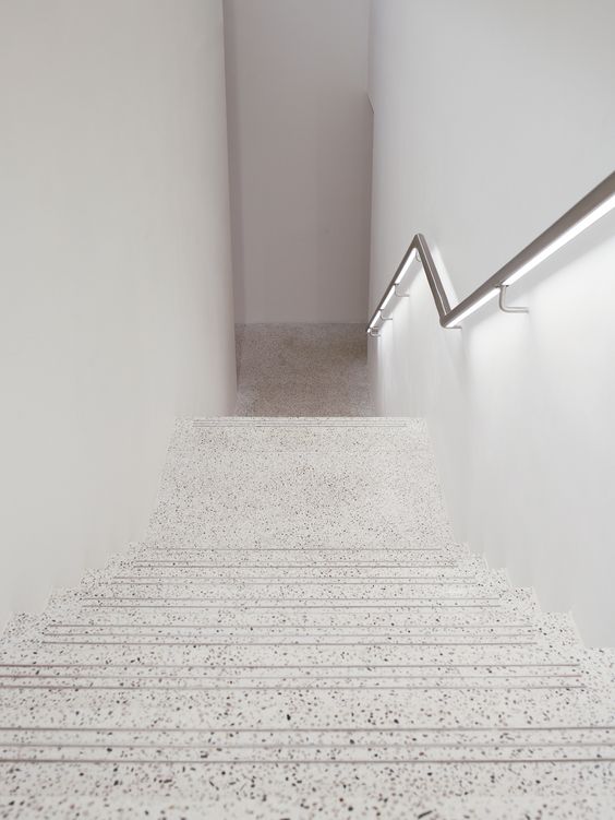 a white terrazzo staircase looks not like your usual stairs