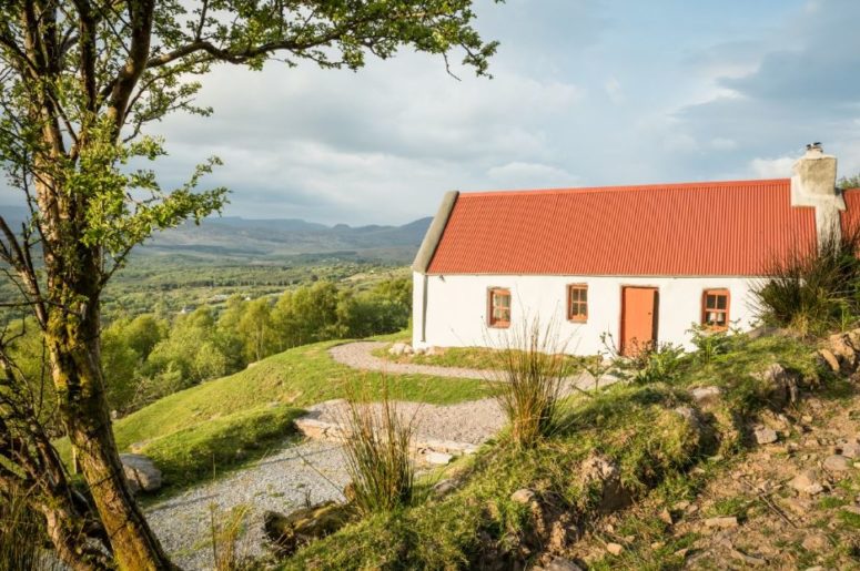 Classic Irish Cottage With A Pastoral Landscape Around