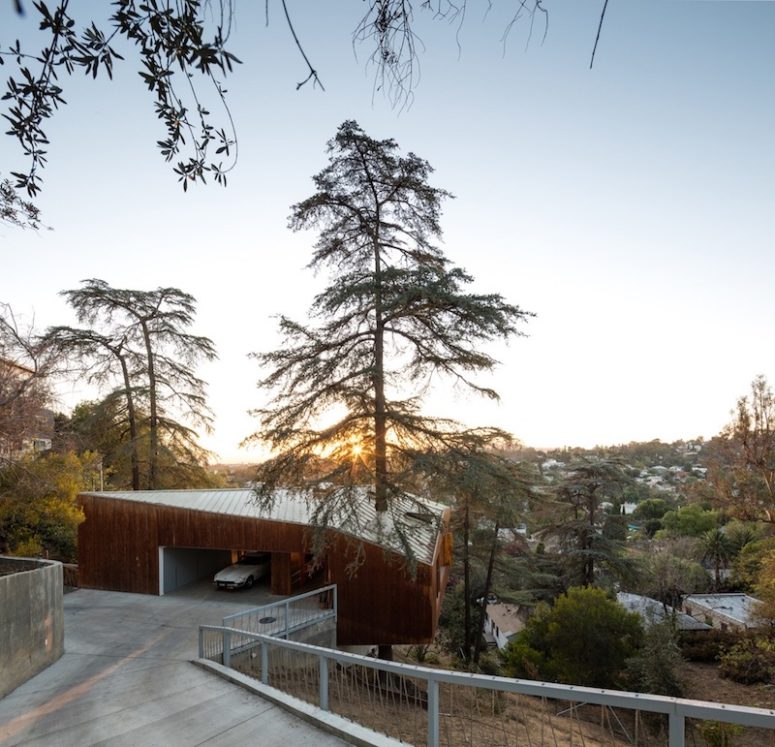 This house is built on a slope and around several mature trees, which makes it unique and super eco friendly