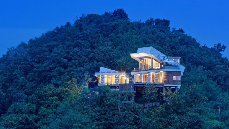 Hillside House With A Shipping Container On Top