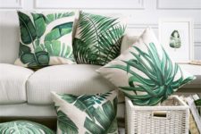 02 a selection of torpical leaf print pillows is a budget-savvy way to brighten up the space
