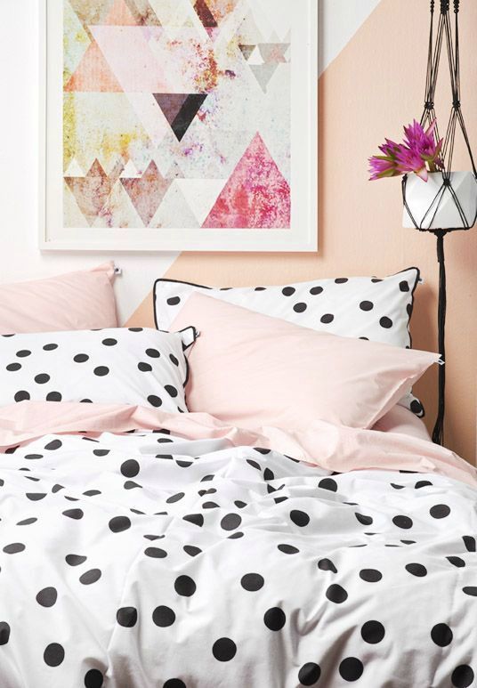 large polka dots with a black edge and pink bedding set for a playful feel in a girlish room