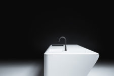 03 There’s an embedded sink and a sleek surface available in many materials and finishes