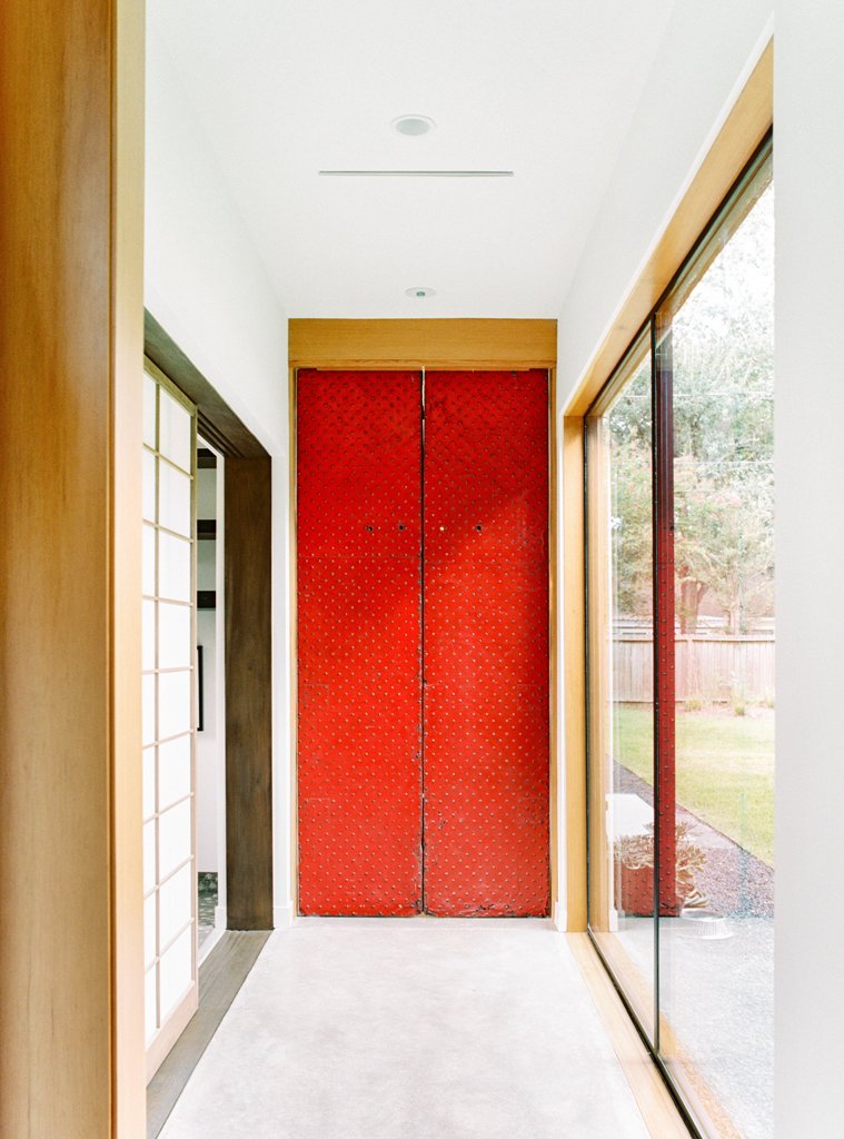 The entrance is traditionally red, it resembles the doors of a Japanese temple