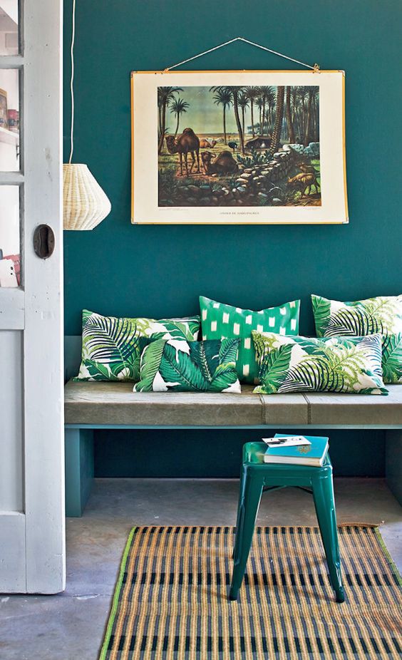 colorful tropical leaf print pillows will spruce up your entryway and make it bold
