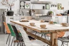05 a modern industrial-inspired space with colorful chairs is made warmer with a wooden table