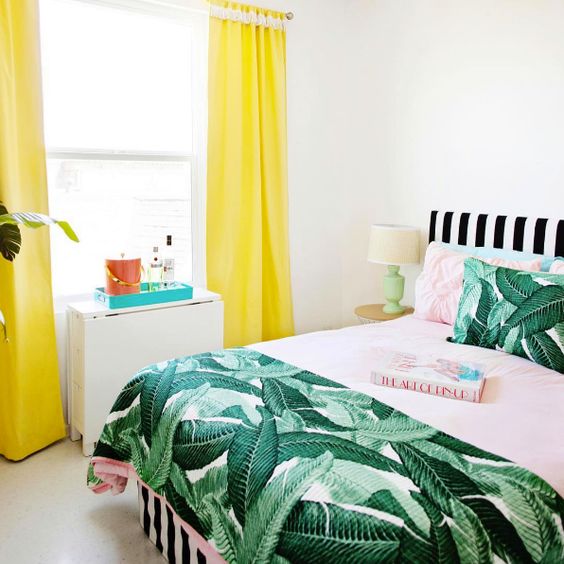 bright colors plus a vintage banana leaf print bedspread and pillows for a playful summer bedroom