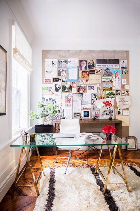 modern feminine home office with a glass desk with metal trestle legs