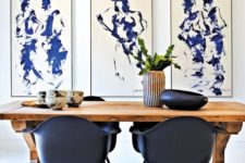 06 a gorgeous modern dining space with a trestle wooden table and black chairs