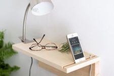 06 a minimalist wooden plank floating nightstand for holding just a couple of things and charging your phone