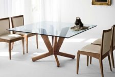07 a square dining table with a glass tabletop and cool and stable wooden legs for a clean modern dining room